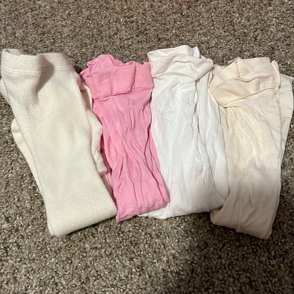 4 pairs of baby girl tights. Size 6-9 months